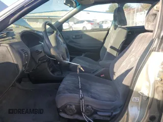 1998 Acura Integra LS with VIN JH4DB7659WS002591, listed as a Copart auction lot 84289584 with 316,458 mi miles and Salvage title. Bid and sale history available at DreamBid. Image 7.