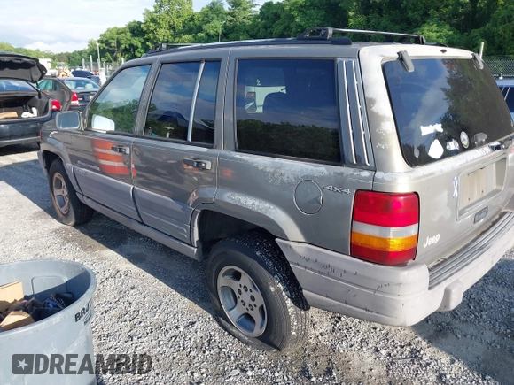 1997 Jeep Grand Cherokee Laredo with VIN 1J4GZ58S1VC603868, listed as a IAAI auction lot 42467813 with 297,306 mi miles and . Bid and sale history available at DreamBid. Image 3.