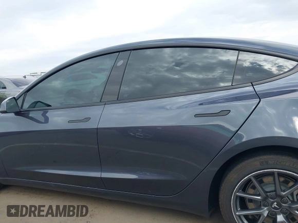2022 Tesla Model 3 Long Range with VIN 5YJ3E1EB9NF164774, listed as a IAAI auction lot 41915755 with 39,625 mi miles and . Bid and sale history available at DreamBid. Image 14.