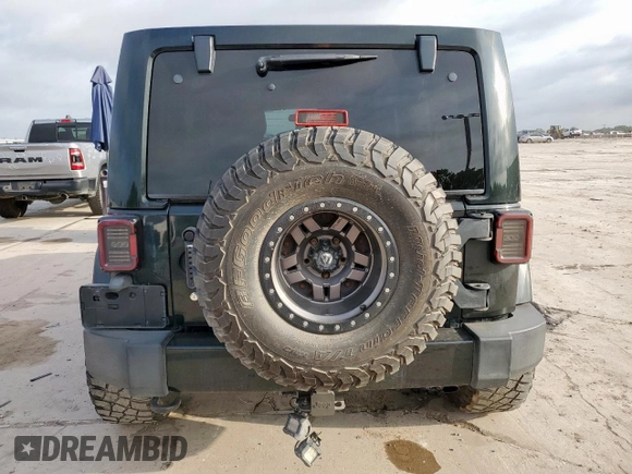 2012 Jeep Wrangler Unlimited Altitude with VIN 1C4HJWEGXCL180602, listed as a Copart auction lot 61391095 with 187,205 mi miles and Salvage title. Bid and sale history available at DreamBid. Image 6.