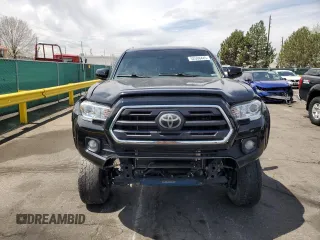 2019 Toyota Tacoma SR z VIN 3TMCZ5AN1KM253032, wystawiony jako Copart lot #52598445 z przebiegiem 69 489 mil mil oraz Szkoda całkowita • Salvage title. Historia ofert i sprzedaży dostępna na DreamBid. Obrazek 5.