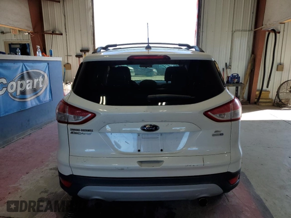 2013 Ford Escape SE with VIN 1FMCU9GX8DUB59593, listed as a Copart auction lot 64526535 with 146,020 mi miles and Salvage title. Bid and sale history available at DreamBid. Image 6.