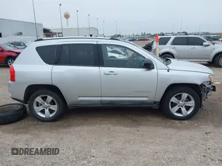 2011 Jeep Compass with VIN 1J4NT1FA7BD142600, listed as a IAAI auction lot 41590661 with 266,600 mi miles. Bid and sale history available at carsss.com. Image 14.