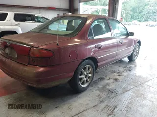 1999 Ford Contour SE z VIN 1FAFP6639XK144984, wystawiony jako IAAI lot #42363538 z przebiegiem 160 891 mil mil oraz . Historia ofert i sprzedaży dostępna na DreamBid. Obrazek 4.