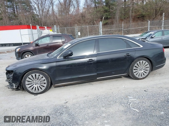 2015 Audi A8 L 4.0T with VIN WAU32AFD7FN006233, listed as a IAAI auction lot 41353034 with 119,693 mi miles. Bid and sale history available at carsss.com. Image 14.