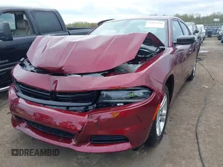 2023 Dodge Charger SXT with VIN 2C3CDXBG9PH659726, listed as a IAAI auction lot 42103636 with 14,321 mi miles and . Bid and sale history available at DreamBid. Image 2.