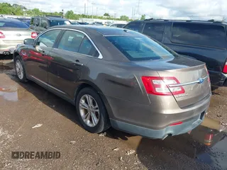 2015 Ford Taurus SEL with VIN 1FAHP2E87FG194170, listed as a IAAI auction lot 42184749 with 222,609 mi miles and . Bid and sale history available at carsss.com. Image 3.