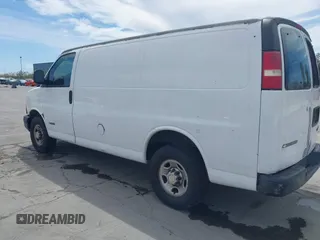 2005 Chevrolet Express Cargo Van with VIN 1GCHG35U651127686, listed as a IAAI auction lot 42028915 with 357,912 mi miles. Bid and sale history available at carsss.com. Image 3.