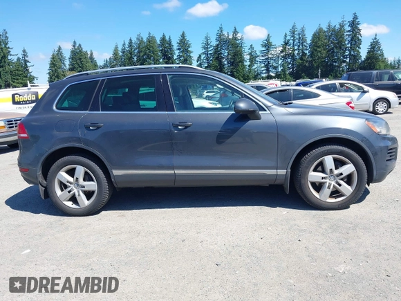 2012 Volkswagen Touareg Sport with VIN WVGFK9BP0CD004951, listed as a IAAI auction lot 42724125 with 173,993 mi miles and . Bid and sale history available at DreamBid. Image 13.