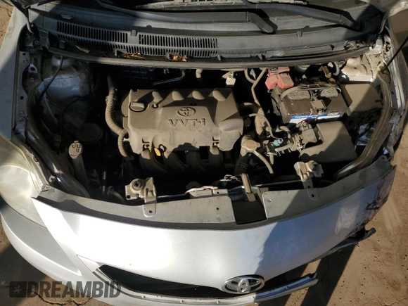 2012 Toyota Yaris z VIN JTDBT4K31CL027483, wystawiony jako Copart lot #59919165 z przebiegiem 81 298 mil mil oraz Szkoda całkowita • Salvage title. Historia ofert i sprzedaży dostępna na DreamBid. Obrazek 11.