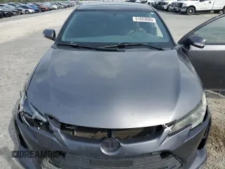 2016 Scion tC z VIN JTKJF5C78GJ019806, wystawiony jako Copart lot #51933685 z przebiegiem 152 395 mil mil oraz Szkody całkowita. Historia ofert i sprzedaży dostępna na DreamBid. Obrazek 11.