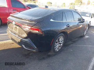2022 Toyota Mirai XLE with VIN JTDAAAAA9NA007013, listed as a IAAI auction lot 41744965 with 23,243 mi miles and . Bid and sale history available at DreamBid. Image 4.