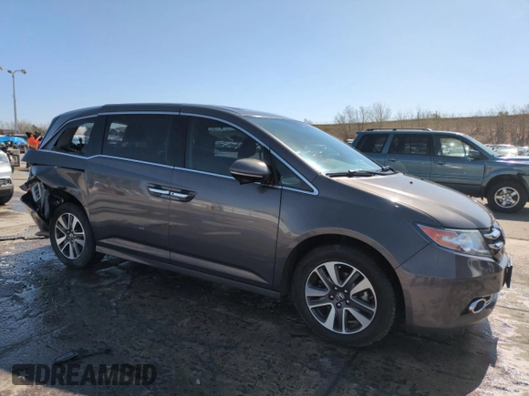 2014 Honda Odyssey Touring with VIN 5FNRL5H95EB052523, listed as a Copart auction lot 52214055 with 131,350 mi miles and Salvage Title. Bid and sale history available at DreamBid. Image 4.