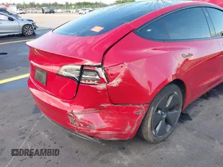 2023 Tesla Model 3 with VIN 5YJ3E1EA2PF588467, listed as a IAAI auction lot 42254921 with 11,217 mi miles and . Bid and sale history available at DreamBid. Image 6.
