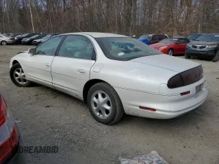 1999 Oldsmobile Aurora with VIN 1G3GR62C4X4112642, listed as a Copart auction lot 48176035 with 100,342 mi miles and Salvage Title. Bid and sale history available at DreamBid. Image 2.