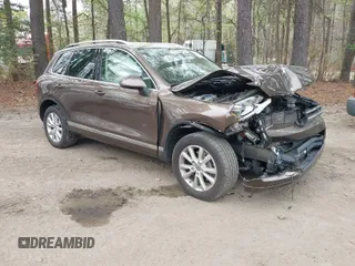 2014 Volkswagen Touareg Sport with VIN WVGEF9BP2ED007904, listed as a IAAI auction lot 41960811 with 126,230 mi miles and . Bid and sale history available at DreamBid. Image 1.