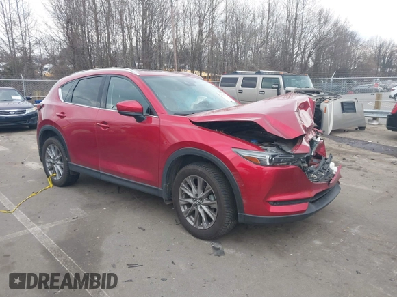 2020 Mazda CX-5 Grand Touring with VIN JM3KFADMXL0842026, listed as a IAAI auction lot 41477339 with 60,755 mi miles. Bid and sale history available at carsss.com. Image 1.