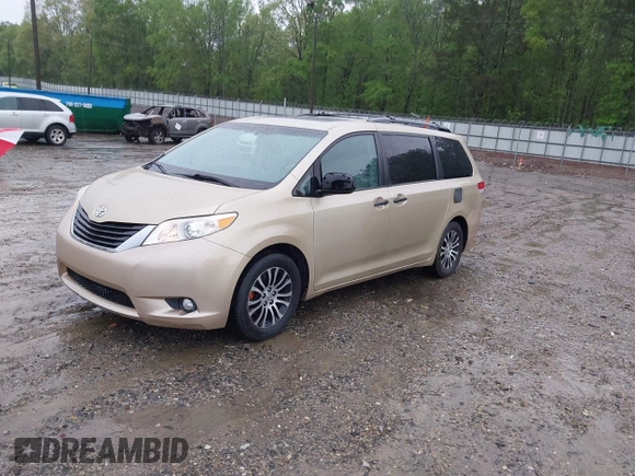 2014 Toyota Sienna XLE with VIN 5TDYK3DC1ES416999, listed as a IAAI auction lot 41972378 with 119,179 mi miles. Bid and sale history available at carsss.com. Image 2.