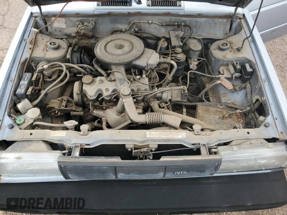 1987 Nissan Sentra z VIN JN1PB2210HU557007, wystawiony jako Copart lot #68174784 z przebiegiem 150 316 mil mil oraz Czysty tytuł • Clean title. Historia ofert i sprzedaży dostępna na DreamBid. Obrazek 11.