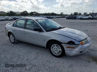 2000 Saturn SL z VIN 1G8ZK5276YZ224500, wystawiony jako Copart lot #45083945 z przebiegiem 130 766 mil mil oraz Szkoda całkowita • Salvage title. Historia ofert i sprzedaży dostępna na DreamBid. Obrazek 4.