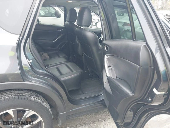 2016 Mazda CX-5 Grand Touring with VIN JM3KE4DY8G0796290, listed as a IAAI auction lot 41619977 with NaN miles. Bid and sale history available at carsss.com. Image 8.