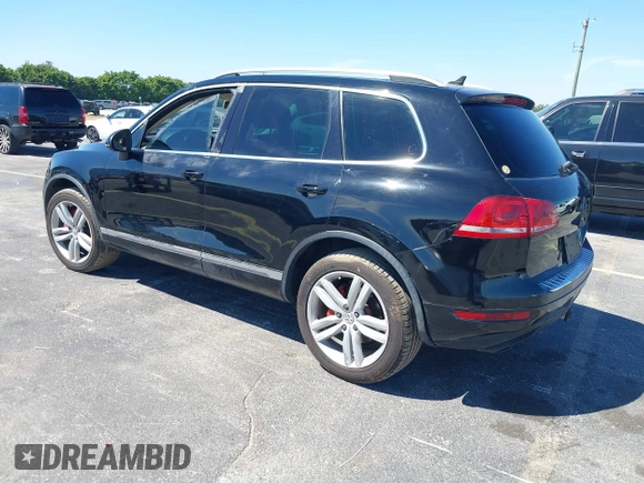 2013 Volkswagen Touareg Lux with VIN WVGEF9BP6DD004454, listed as a IAAI auction lot 41862958 with 239,548 mi miles and . Bid and sale history available at DreamBid. Image 3.