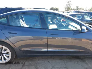 2022 Tesla Model 3 with VIN 5YJ3E1EA8NF241691, listed as a IAAI auction lot 41742584 with 70,375 mi miles and . Bid and sale history available at DreamBid. Image 13.