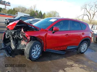 2015 Mazda CX-5 Sport z VIN JM3KE2BE7F0516869, wystawiony jako IAAI lot #41866488 z przebiegiem 131 237 mil mil oraz . Historia ofert i sprzedaży dostępna na DreamBid. Obrazek 14.