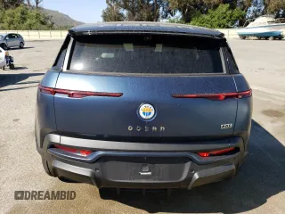 2023 Fisker Ocean One z VIN VCF1ZBU27PG001925, wystawiony jako Copart lot #65253054 z przebiegiem 5757 mil mil oraz Szkody całkowita. Historia ofert i sprzedaży dostępna na DreamBid. Obrazek 6.