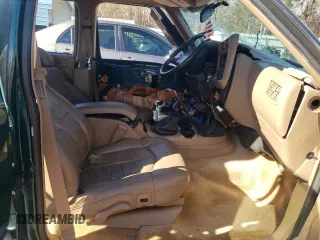 1997 GMC Jimmy SL with VIN 1GKCS13W2V2518446, listed as a Copart auction lot 86629634 with 183,089 mi miles and Salvage Title. Bid and sale history available at carsss.com. Image 7.