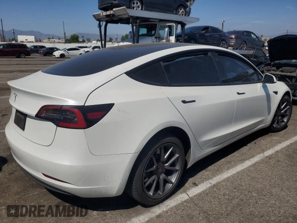 2023 Tesla Model 3 with VIN 5YJ3E1EA8PF394705, listed as a Copart auction lot 52319945 with 58,193 mi miles and Salvage title. Bid and sale history available at DreamBid. Image 3.
