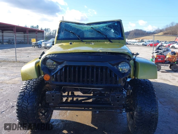 2007 Jeep Wrangler Unlimited Sahara with VIN 1J4GA59187L189519, listed as a IAAI auction lot 41204036 with 165,428 mi miles and . Bid and sale history available at DreamBid. Image 12.