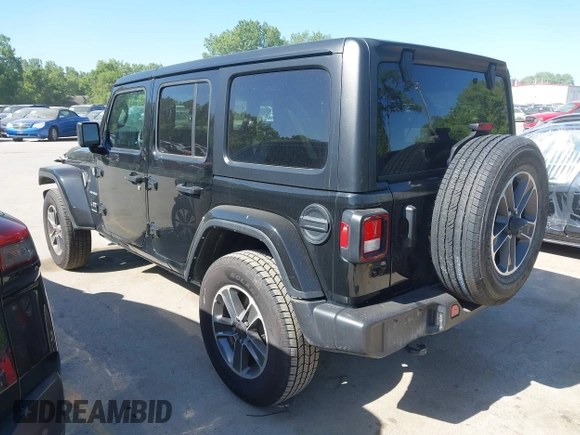 2023 Jeep Wrangler Sahara with VIN 1C4HJXEN5PW702268, listed as a IAAI auction lot 42288704 with 57,240 mi miles and . Bid and sale history available at DreamBid. Image 3.