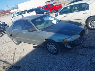 1999 Mazda 626 LX with VIN 1YVGF22DXX5847298, listed as a IAAI auction lot 41236165 with 194,445 mi miles. Bid and sale history available at carsss.com. Image 1.