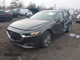 2023 Mazda 3 S Select with VIN 3MZBPABM2PM354066, listed as a IAAI auction lot 41339983 with 13,536 mi miles and . Bid and sale history available at DreamBid. Image 2.