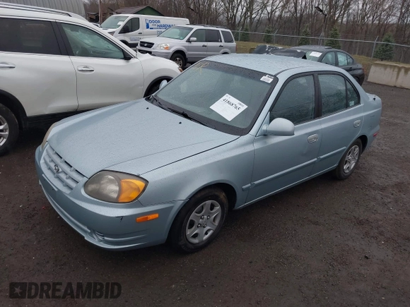 2003 Hyundai Accent GL with VIN KMHCG45C33U473080, listed as a IAAI auction lot 41868765 with 57,478 mi miles. Bid and sale history available at carsss.com. Image 2.