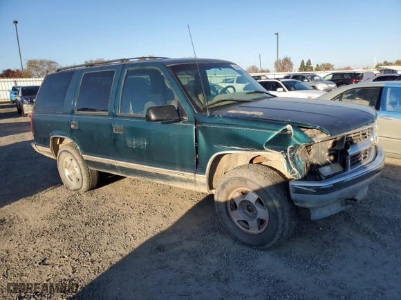1995 Chevrolet Tahoe with VIN 1GNEK13K0SJ445250, listed as a Copart auction lot 82987024 with 125,517 mi miles and Salvage Title. Bid and sale history available at carsss.com. Image 4.