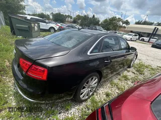 2012 Audi A8 z VIN WAURVAFD6CN015907, wystawiony jako Copart lot #59188515 z przebiegiem 112 879 mil mil oraz Czysty tytuł • Clean title. Historia ofert i sprzedaży dostępna na DreamBid. Obrazek 4.