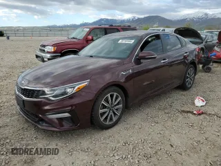 2019 Kia Optima LX z VIN 5XXGT4L31KG354615, wystawiony jako Copart lot #50752584 z przebiegiem 77 029 mil mil oraz Szkoda całkowita • Salvage title. Historia ofert i sprzedaży dostępna na DreamBid. Obrazek 1.