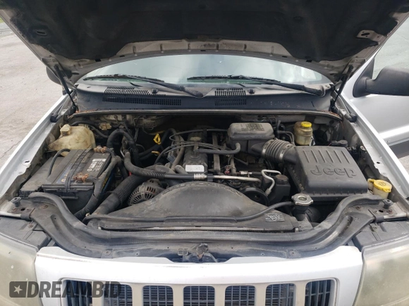 2004 Jeep Grand Cherokee Laredo z VIN 1J4GW48S14C288605, wystawiony jako Copart lot #60204815 z przebiegiem 247 816 mil mil oraz Szkoda całkowita • Salvage title. Historia ofert i sprzedaży dostępna na DreamBid. Obrazek 12.