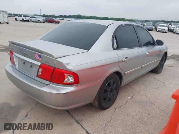2003 Kia Optima LX z VIN KNAGD128235248556, wystawiony jako IAAI lot #42366002 z przebiegiem 140 904 mil mil oraz . Historia ofert i sprzedaży dostępna na DreamBid. Obrazek 4.