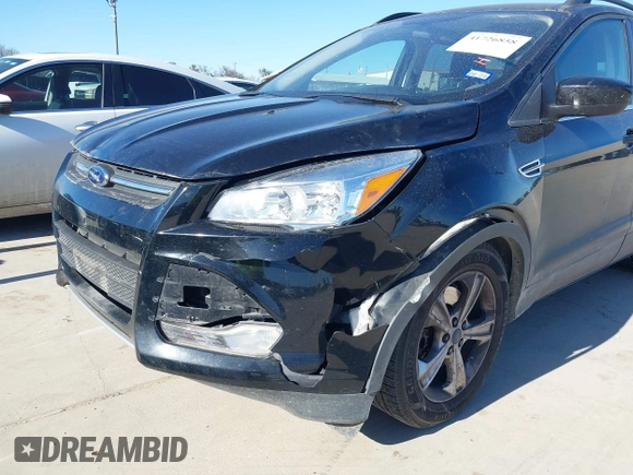 2016 Ford Escape SE with VIN 1FMCU0G99GUC19883, listed as a IAAI auction lot 41726858 with 156,863 mi miles. Bid and sale history available at carsss.com. Image 6.