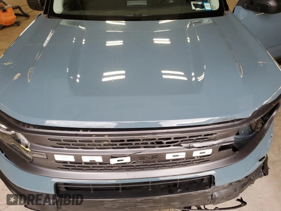2022 Ford Bronco Sport Badlands z VIN 3FMCR9D92NRE21849, wystawiony jako Copart lot #56589985 z przebiegiem Nie podano mil oraz Szkoda całkowita • Salvage title. Historia ofert i sprzedaży dostępna na DreamBid. Obrazek 12.