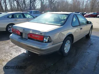 1995 Ford Thunderbird LX with VIN 1FALP62W9SH206490, listed as a IAAI auction lot 41744430 with 111,365 mi miles. Bid and sale history available at carsss.com. Image 4.