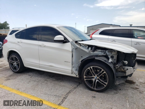 2015 BMW X4 xDrive28i with VIN 5UXXW3C54F0M89077, listed as a Copart auction lot 62282333 with 126,467 mi miles. Bid and sale history available at carsss.com. Image 4.