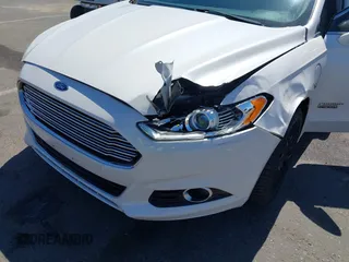 2016 Ford Fusion Titanium z VIN 3FA6P0SU2GR357508, wystawiony jako IAAI lot #42551834 z przebiegiem 177 425 mil mil oraz . Historia ofert i sprzedaży dostępna na DreamBid. Obrazek 6.