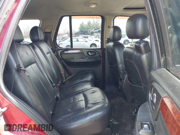 2005 GMC Envoy SLE with VIN 1GKDT13S252127604, listed as a IAAI auction lot 41898390 with 210,655 mi miles. Bid and sale history available at carsss.com. Image 8.