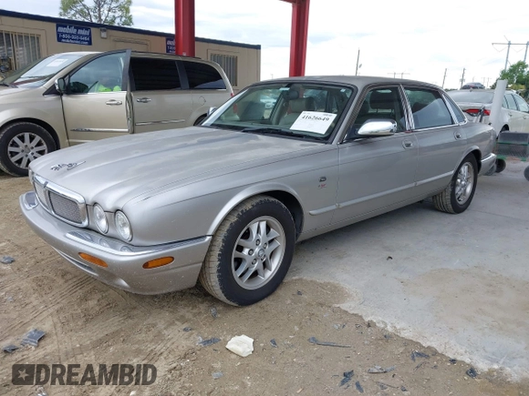 1999 Jaguar XJ with VIN SAJHX1043XC856474, listed as a IAAI auction lot 41626649 with 103,266 mi miles and . Bid and sale history available at DreamBid. Image 2.