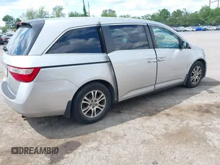 2012 Honda Odyssey EX-L with VIN 5FNRL5H67CB139701, listed as a IAAI auction lot 42233283 with 147,143 mi miles and . Bid and sale history available at DreamBid. Image 4.