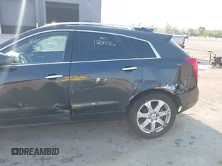 2014 Cadillac SRX Performance Collection with VIN 3GYFNFE35ES663320, listed as a IAAI auction lot 42480235 with 112,406 mi miles and . Bid and sale history available at DreamBid. Image 6.